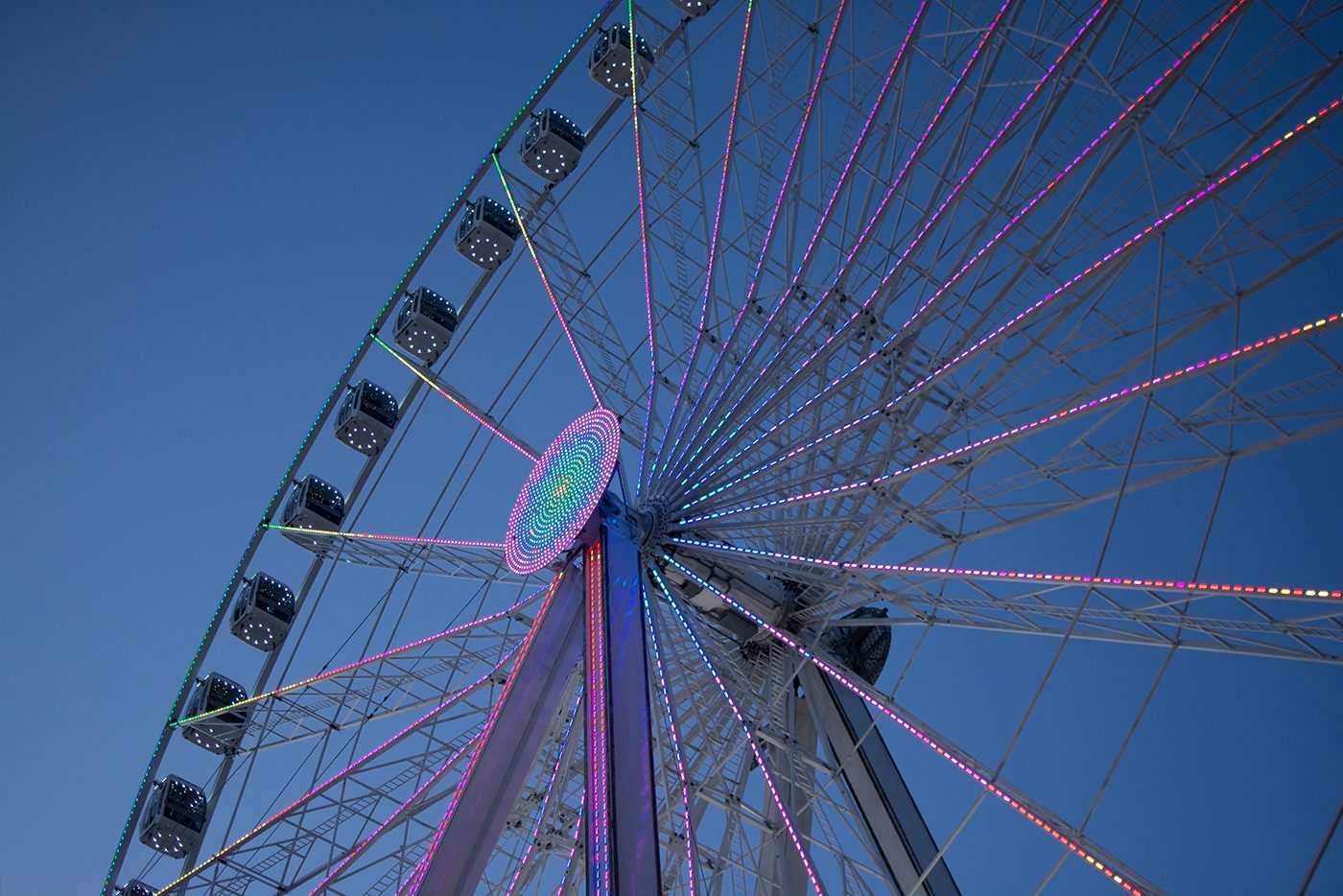 Lit Ferris wheel against a dusk sky, before the preset